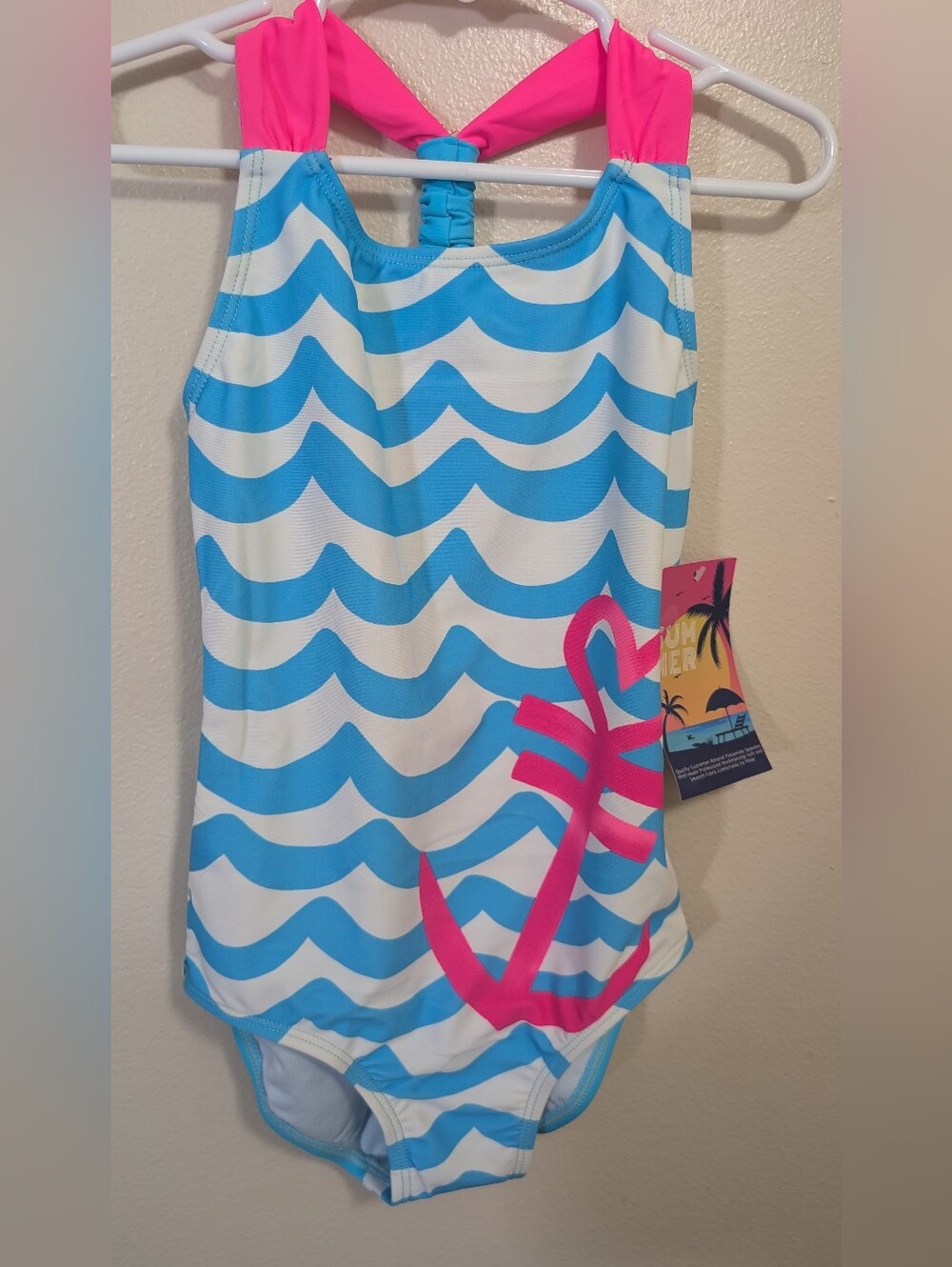 Girls One-Piece Swimsuit in Bright Blue with White Waves and Pink Anchor
